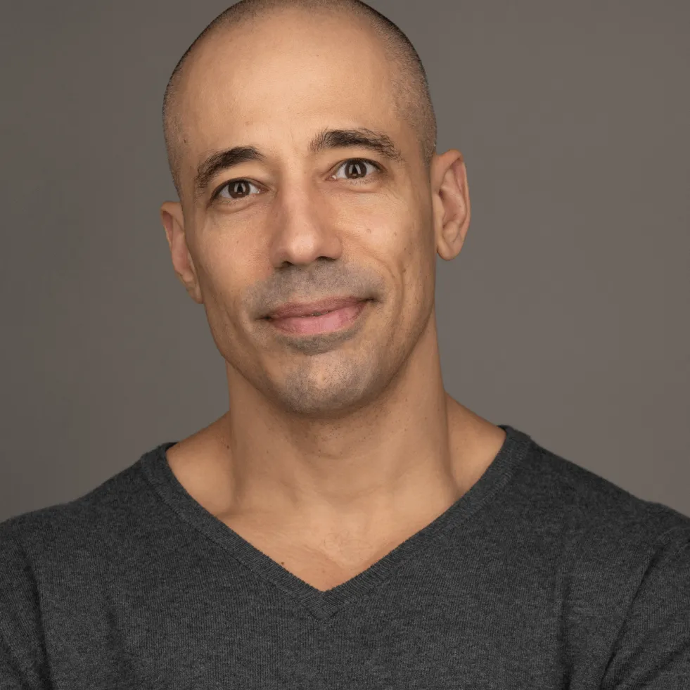 Dr. Shadi Ireifej, a Wuffes veterinary advisor, in a grey t-shirt against a dark backdrop