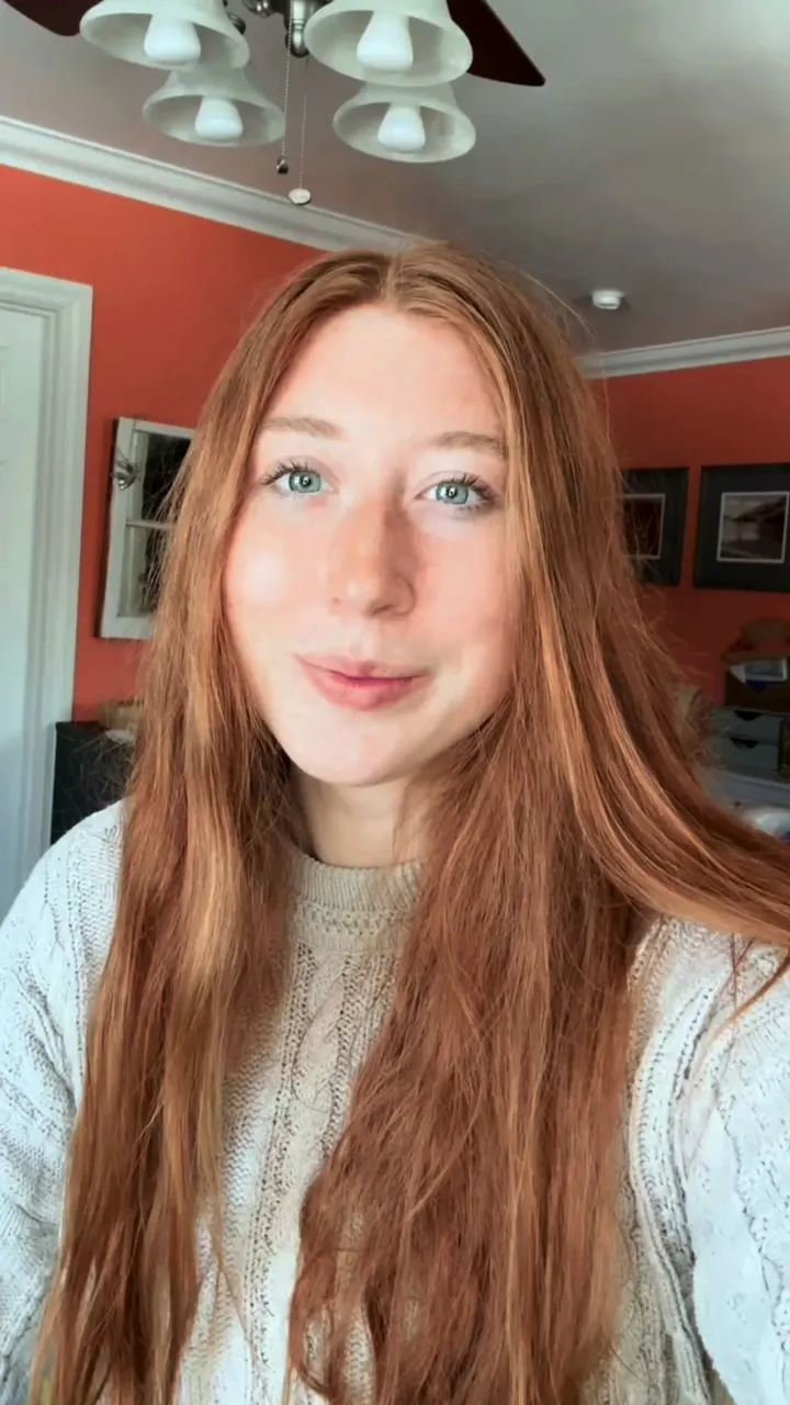 A customer filming herself at home, talking about her dog's allergy and itch relief