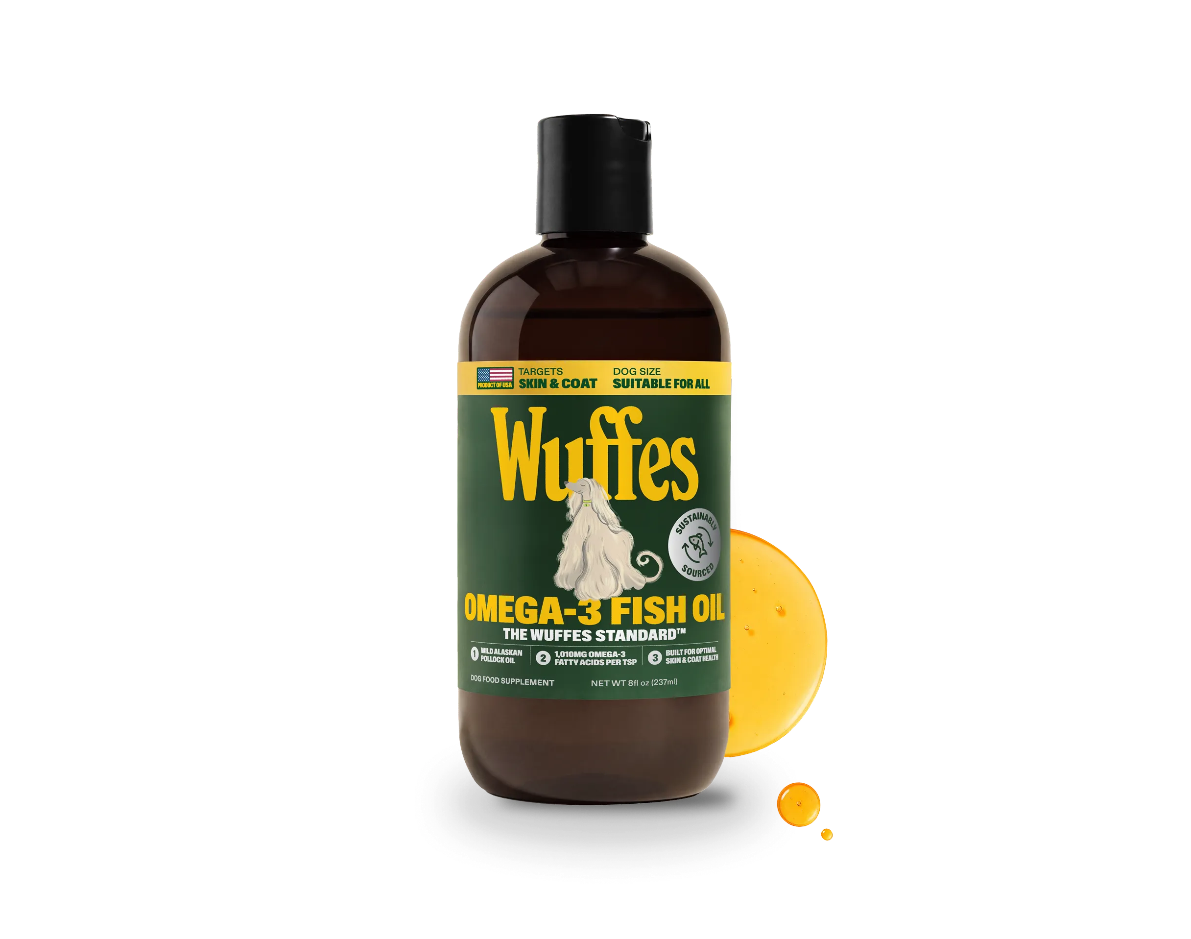 A dark amber bottle of Wuffes Omega-3 Fish Oil for dogs with a black cap and a dark green label, labelled for skin and coat and showing an illustrated long-haired white dog, a large splash of golden oil and two drops beside it