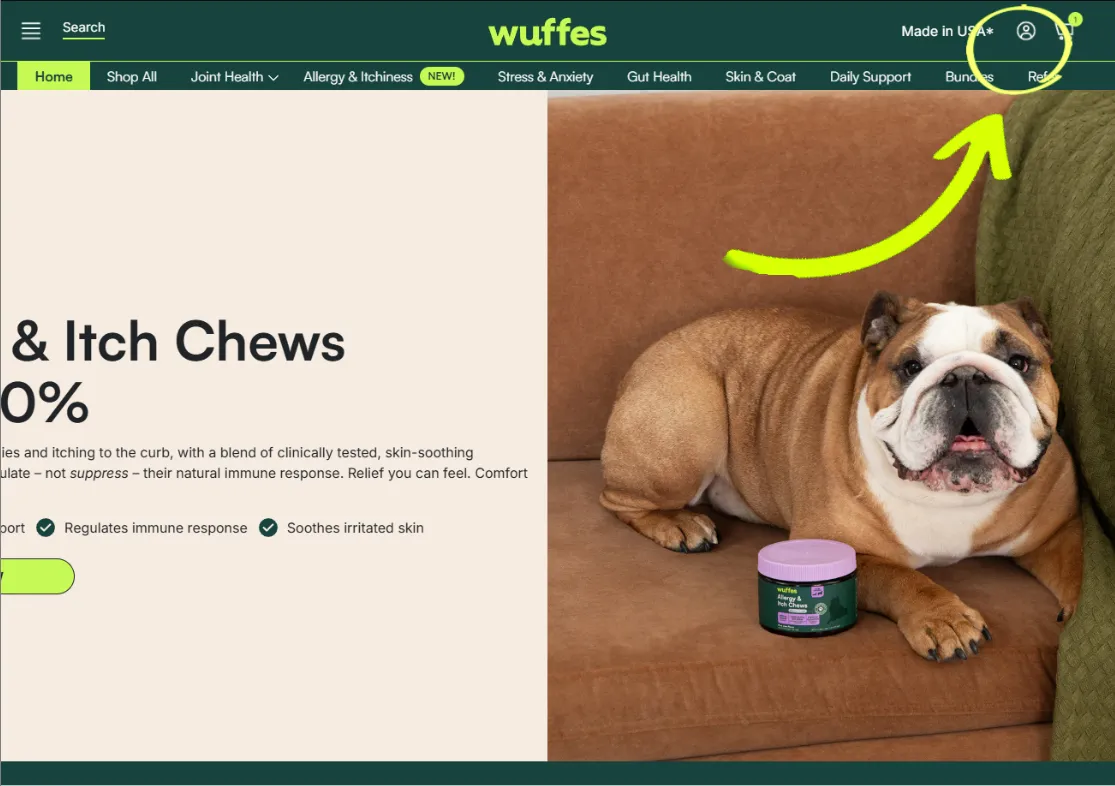 The Wuffes homepage with an arrow pointing to the account icon, circled, at the top right of the header next to the cart