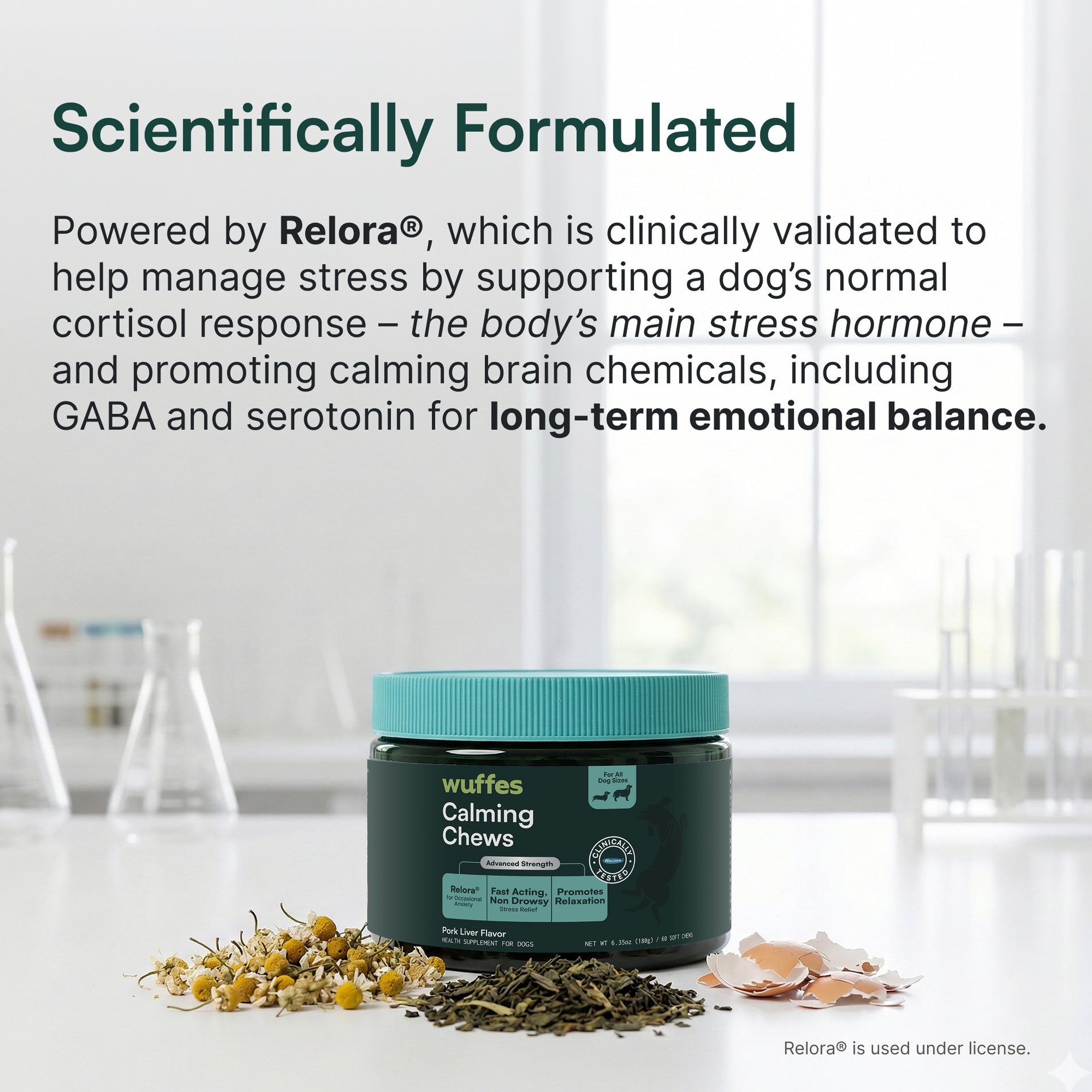 Container of calming chews with chamomile, loose herbs, and eggshells on lab surface