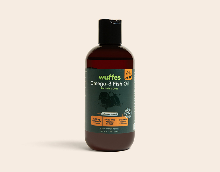 Bottle of Wuffes Omega-3 fish oil supplement for dog skin and coat with black cap