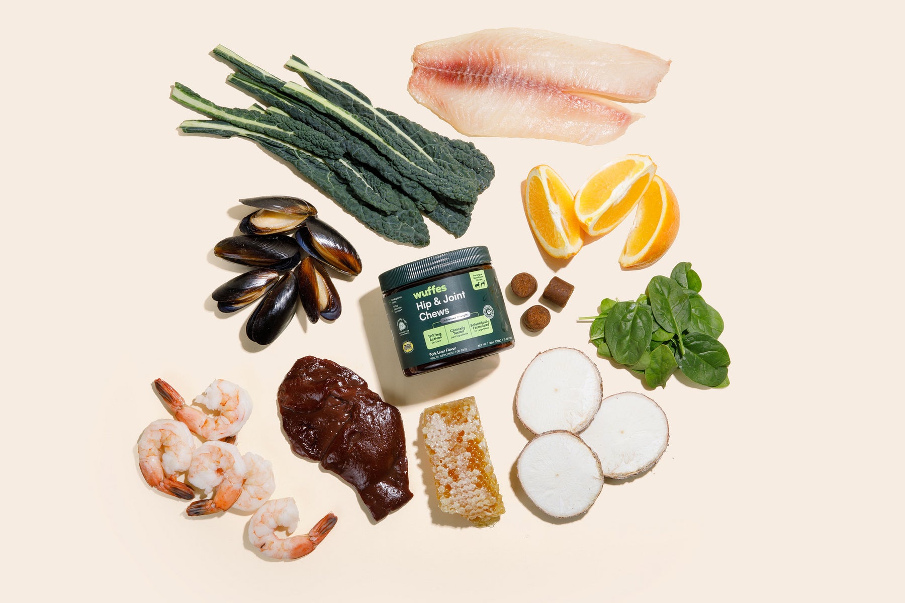 Assorted food items including fish, vegetables, and a jar of mackerel pate on a beige background